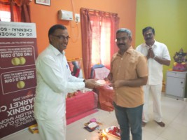 Manava Seva Madhava Seva. District President Presenting Momento to Secretary of the Apartment